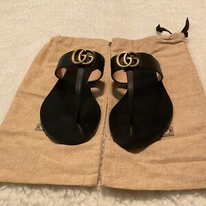 Gucci Black Sandals with Gold Emblem (Worn Once)